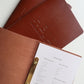Tan leather menu open to the menu page