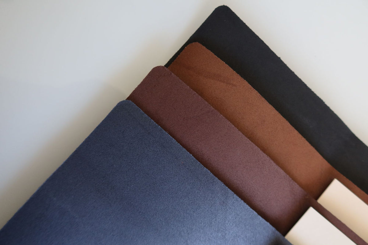 Navy, brown and black leather menus fanned