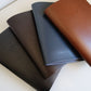 Leather menus fanned in four colours