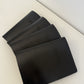 Black leather menus fanned